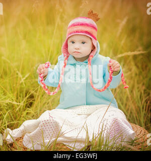 baby with Down syndrome looks surprised Stock Photo