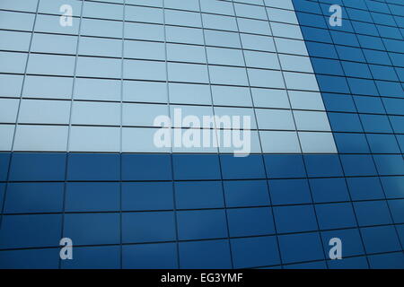 solid high wall decorated blue and white colors sanding on the building of water pool on Gagarin Street, February, 10, 2015, Vileyka, Belarus Stock Photo