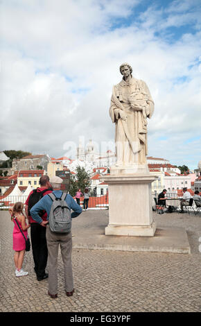 Statue of St Vincent on top of the Cerca Moura (city wall) in the Sao Vincente de Fora area of Lisbon, Portugal. Stock Photo