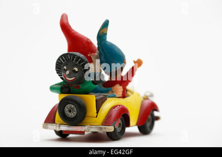 Noddy driving his car with Big Ears and Golly sitting in the back. Stock Photo