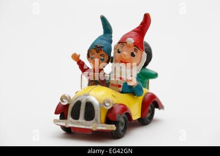 Noddy driving his car with Big Ears and Golly sitting in the back. Stock Photo