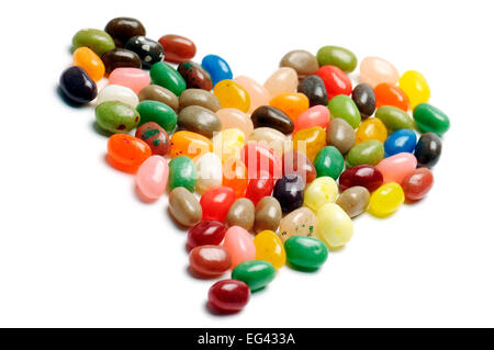 fruit jelly beans, heart-shaped on white background Stock Photo
