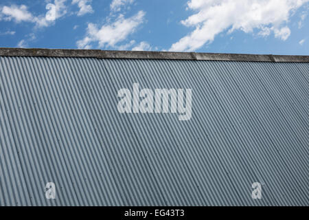 Corrugated iron and blue sky abstract background Stock Photo