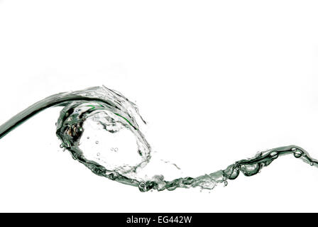 wave of clear water fluid captured in cross section as surface crest peak starts to shower down on trough Stock Photo
