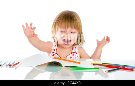 Little baby girl draws pencil on a white background Stock Photo