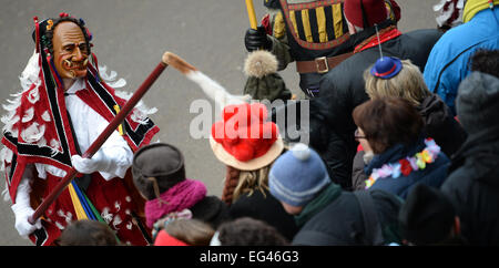 Rottweil, Germany. 16th Feb, 2015.  A 'Federahannes', teases a spectator during the 'Narrensprung' (lit. jester jump) parade in Rottweil, Germany, 16 February 2015. About 4000 jesters paraded through the city among thousands of spectators. The Rottweil Narrensprung is the highlight of the Swabian-Alemannic Fastnacht and one of the traditional pre-Lenten carnival parades in the South-West. Photo: Patrick Seeger/dpa/Alamy Live News  Stock Photo