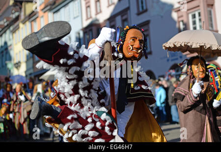 Rottweil, Germany. 16th Feb, 2015.  A 'Federahannes', a jester figure from Rottweil, is doing the 'Narrensprung' (lit. jester jump) in Rottweil, Germany, 16 February 2015. About 4000 jesters paraded through the city among thousands of spectators. The Rottweil Narrensprung is the highlight of the Swabian-Alemannic Fastnacht and one of the traditional pre-Lenten carnival parades in the South-West. Photo: Patrick Seeger/dpa/Alamy Live News  Stock Photo