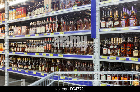 Showcase alcoholic beverages at the hypermarket METRO. Stock Photo