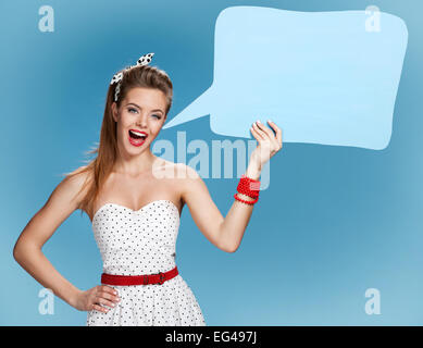Woman showing sign speech bubble banner looking happy excited Stock Photo