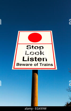 Beware of trains sign stop look listen warning at level crossing on ...