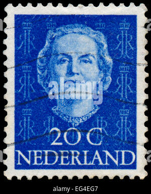 NETHERLANDS - CIRCA 1949: A stamp printed in Netherlands, shows portrait of Queen Juliana, monogram and a crown without inscript