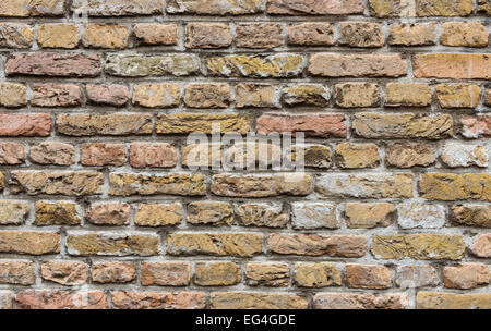 Yellow and red brick wall. Stock Photo