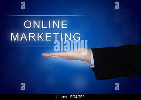 online marketing button with business hand on blue background Stock Photo