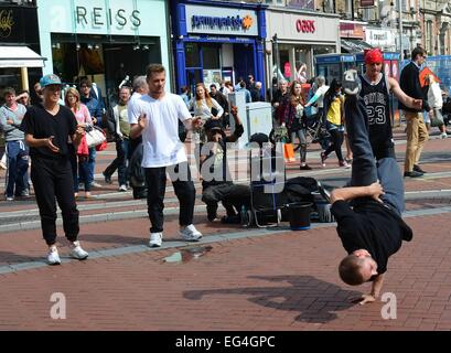 Cillian Murphy, wife Yvonne and their sons Malachy and Aran watch break-dance buskers Dublin City BBoys on Grafton Street  Where: Dublin, Ireland When: 14 Aug 2014 Stock Photo