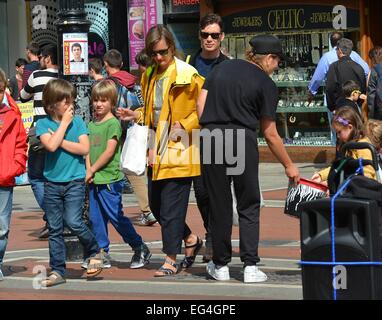 Cillian Murphy, wife Yvonne and their sons Malachy and Aran watch break-dance buskers Dublin City BBoys on Grafton Street  Featuring: Cillian Murphy,Yvonne McGuinness,Malachy Murphy,Aran Murphy Where: Dublin, Ireland When: 14 Aug 2014 Stock Photo