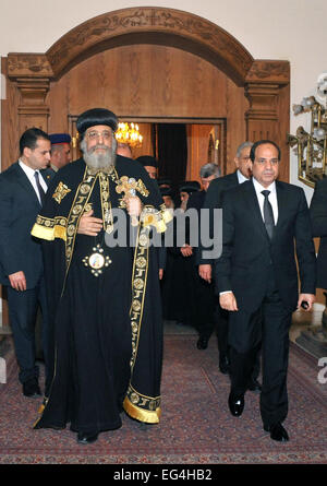 Cairo. 16th Feb, 2015. The photo released by Egyptian state-run news agency MENA shows that Egyptian President Abdel Fattah al-Sisi (R) walks with Egypt's Coptic Pope Tawadros II (L) at Saint Mark Cathedral before their meeting, in Cairo, Egypt, on Feb. 16, 2015, one day after 21 Egyptian Coptic Christians were purportedly murdered by Islamic State (IS) group militants in Libya. Credit:  MENA/Xinhua/Alamy Live News Stock Photo