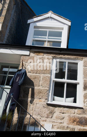 Wet suit outside a house in St. Ives house in St. Ives, Cornwall, England Stock Photo