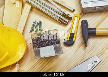 Assorted Woodwork and Carpentry or Construction Tools on Pine Wood Texture Background. Stock Photo