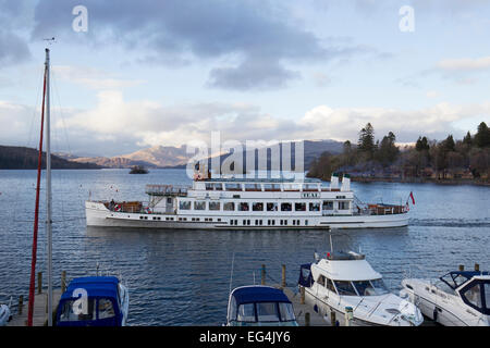 Lake Windermere, Cumbria, UK. 16th February, 2015. UK Weather: Last of the snow on the high fells Boat trips on the  steamer MV Teal , in its 80th year ,(launched 1936) back on Lake Windermere for half term after its annual service Credit:  Gordon Shoosmith/Alamy Live News Stock Photo