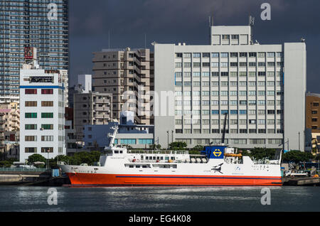 The 'Ferry Zamami' on anchor in Tomari Port, Naha, Okinawa, Japan Stock Photo