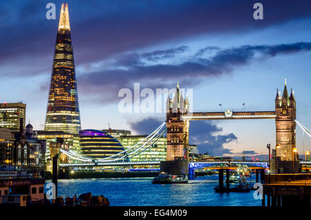 Tower Bridge and The Shard viewed from the north bank of the Thames at night. London, UK Stock Photo