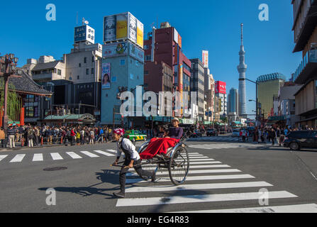 TOKYO, JAPAN - November, 23, 2014: Tokyo sightseeing by rickshaw tour, Asakusa historic district Stock Photo