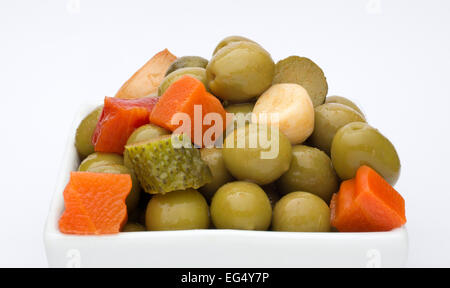 Pickled gherkins olives onions carrots garlic red pepper chili Stock Photo