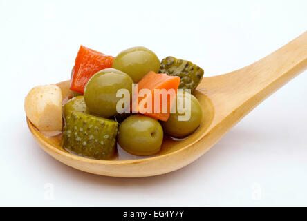 Pickled gherkins olives onions carrots garlic red pepper chili Stock Photo