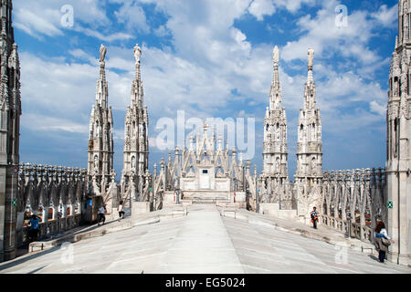 Spires and people on roof top, Milan Cathedral (Duomo di Milano), Milan, Italy Stock Photo