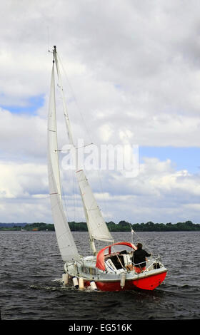 Sailboat sailing on Lough derg in Tipperary Ireland Stock Photo