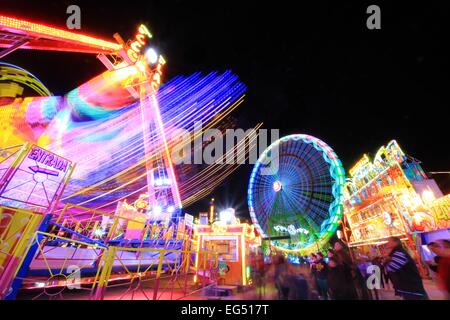 Carousel and color games in amusement park at night Stock Photo
