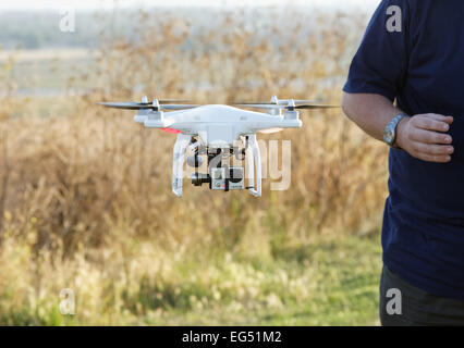 small drone / multicoptor flying with GoPro video camera Stock Photo