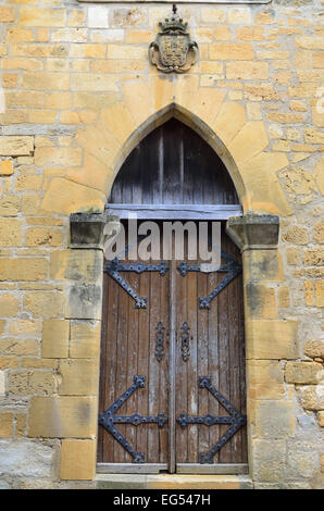 Wooden door in the medieval house Stock Photo