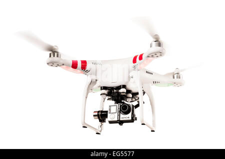 A DJI phantom quadcopter or drone flying on a white background Stock Photo