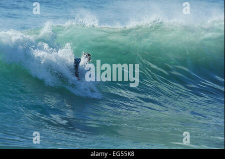 Durban, KwaZulu-Natal, South Africa, adult man surfing Boogie board down wave, flying white foam spray, Golden Mile beachfront, people, beach Stock Photo
