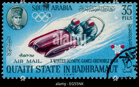 SOUTH ARABIA - CIRCA 1968: A stamp printed in South Arabia in Kathiri state in Hadhramaut shows Olympic Games in Grenoble , circ Stock Photo