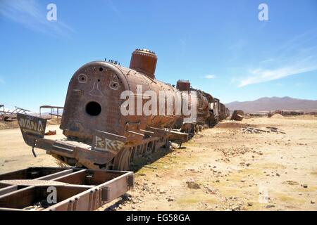 Rusty old steam locomotive near Salar de Uyuni train cemetery on Bolivia's altiplano Stock Photo