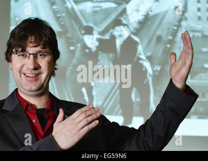 Berlin, Germany. 24th Jan, 2015. dpa-EXKLUSIVE - Pianist Carsten-Stephan Graf von Bothmer stands in front of screen which displays the Silent film comedians Stan Laurel and Oliver Hardy at the 'Passionskirche' church in Berlin, Germany, 24 January 2015. Pianist Graf von Bothmer performs live music as part of a series of silent films. Photo: Jens Kalaene/dpa/Alamy Live News Stock Photo