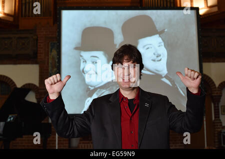 Berlin, Germany. 24th Jan, 2015. dpa-EXCLUSIVE - Pianist Carsten-Stephan Graf von Bothmer stands in front of screen which displays the Silent film comedians Stan Laurel and Oliver Hardy at the 'Passionskirche' church in Berlin, Germany, 24 January 2015. Pianist Graf von Bothmer performs live music as part of a series of silent films. Photo: Jens Kalaene/dpa/Alamy Live News Stock Photo