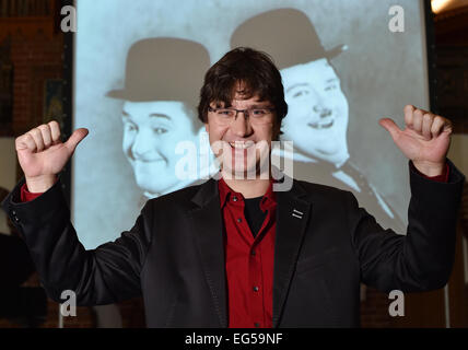 Berlin, Germany. 24th Jan, 2015. dpa-EXCLUSIVE - Pianist Carsten-Stephan Graf von Bothmer stands in front of screen which displays the Silent film comedians Stan Laurel and Oliver Hardy at the 'Passionskirche' church in Berlin, Germany, 24 January 2015. Pianist Graf von Bothmer performs live music as part of a series of silent films. Photo: Jens Kalaene/dpa/Alamy Live News Stock Photo