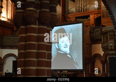 Berlin, Germany. 24th Jan, 2015. dpa-EXCLUSIVE - Silent film comedian Oliver Hardy is on display on a screen at the 'Passionskirche' church in Berlin, Germany, 24 January 2015. Pianist Carsten-Stephan Graf von Bothmer performs live music as part of a series of silent films. Photo: Jens Kalaene/dpa/Alamy Live News Stock Photo