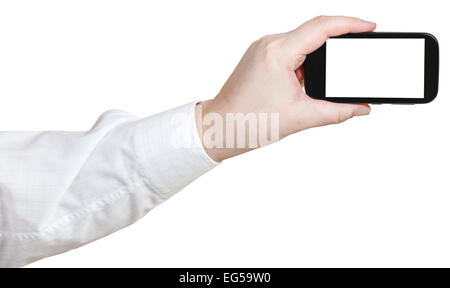 businessman photoshoots by smart phone with cut out screen isolated on white background Stock Photo