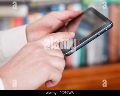 businessman touch tablet pc screen in office room Stock Photo