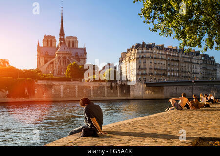 Paris, people relaxing along Seine river Stock Photo