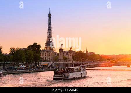 Paris, Tour boat on the Seine river at Sunset Stock Photo