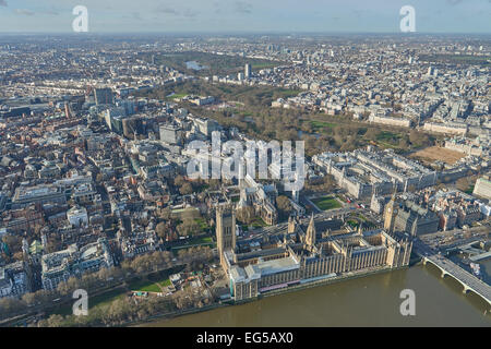 An aerial view of the Houses of Parliament with Westminster Abbey, Green Park and Hyde Park visible in the background Stock Photo