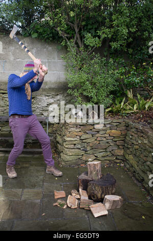 A man chopping wood in his garden Stock Photo