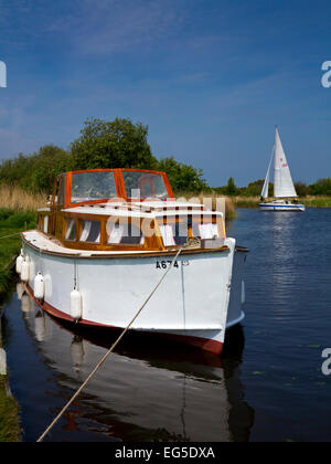 Boat moored at Martham Broad in the Norfolk Broads England UK an area of inland waterways popularly used for sailing holidays Stock Photo