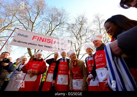 Londdon, UK. 17th Feb, 2015. The 17th annual pancake race bettween teams from Media and Parliament was held in Victoria Tower Gardens, It was won by the media team Credit:  Rachel Megawhat/Alamy Live News Stock Photo