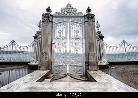 ISTANBUL, Turkey (Turkiye) — A gate opening to the Bosphorus Strait at Dolmabahçe Palace. Dolmabahçe Palace, on the banks of the Bosphorus Strait, was the administrative center of the Ottoman Empire from 1856 to 1887 and 1909 to 1922. Built and decorated in the Ottoman Baroque style, it stretches along a section of the European coast of the Bosphorus Strait in central Istanbul. Stock Photo
